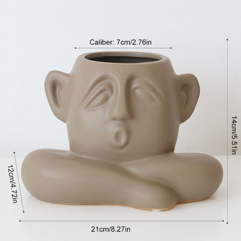 Ceramic face vase decoration