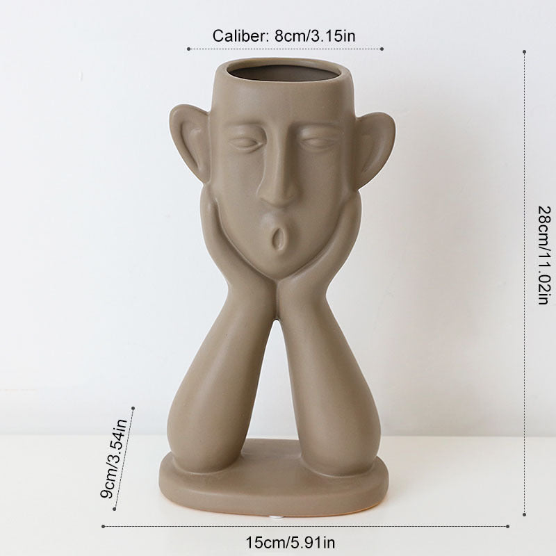Ceramic face vase decoration